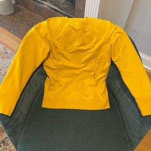 Lululemon mustard yellow sweatshirt with pocket.